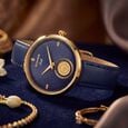 Sonata Gold White Dial Leather Strap Watch for Women with 22K Tanishq Gold Coin
